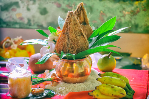 Grih pravesh puja with priest cutting child's hair in sacred tradition